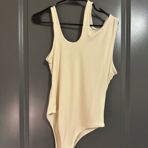 Cream bodysuit with cutout detail #cutoutdetail